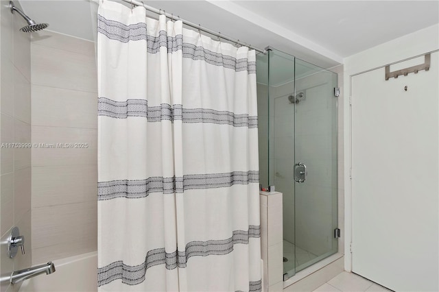 bathroom with enclosed tub / shower combo and tile patterned floors