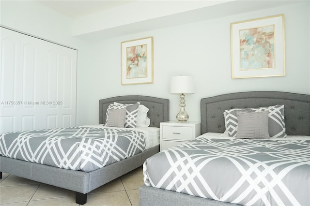 bedroom featuring a closet and tile patterned flooring