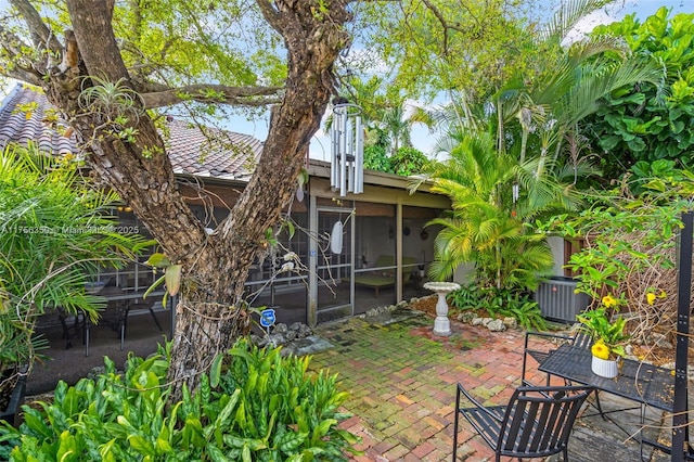 exterior space featuring a sunroom