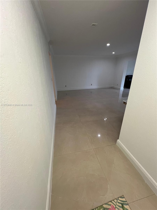 hall with crown molding, light tile patterned floors, recessed lighting, and baseboards