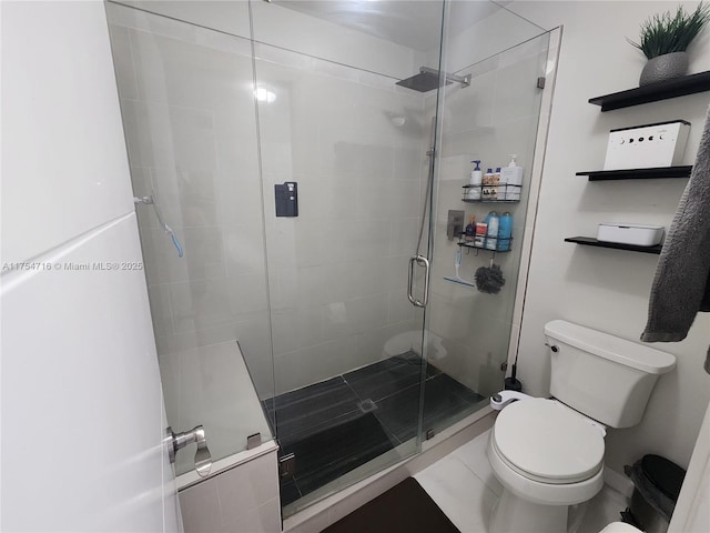 full bathroom with a shower stall and toilet