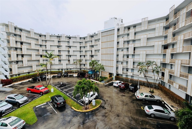 view of building exterior featuring uncovered parking