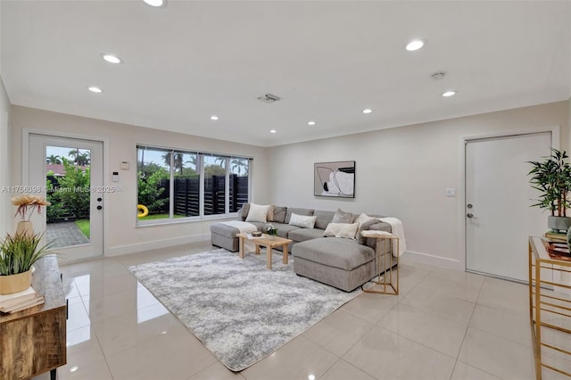 living area featuring recessed lighting, visible vents, baseboards, and light tile patterned floors