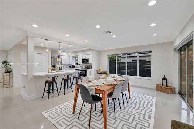 dining area featuring light tile patterned floors, baseboards, visible vents, and recessed lighting