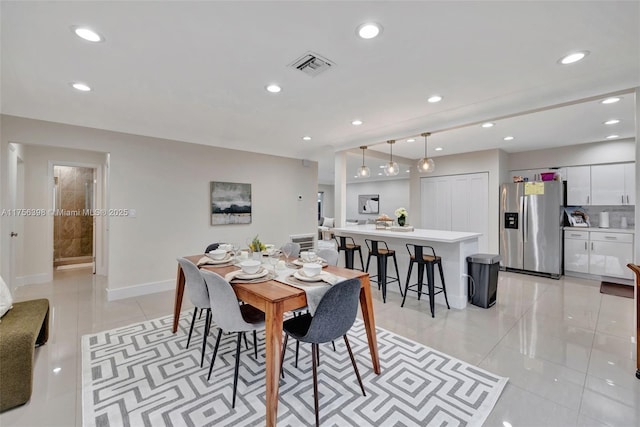 dining room featuring recessed lighting, visible vents, baseboards, and light tile patterned floors