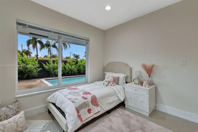 bedroom featuring baseboards and recessed lighting