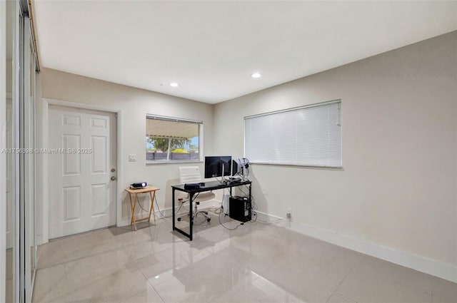 office featuring recessed lighting, light tile patterned flooring, and baseboards