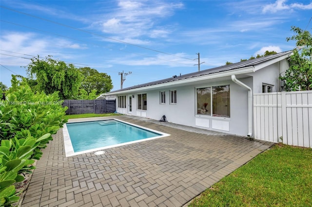 view of pool featuring a patio, a fenced backyard, and a fenced in pool