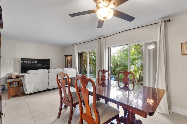 dining room featuring a ceiling fan and light tile patterned flooring