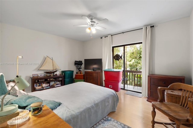 bedroom featuring light wood-type flooring, access to exterior, and a ceiling fan