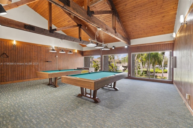 recreation room featuring wooden ceiling, carpet flooring, wood walls, and beamed ceiling