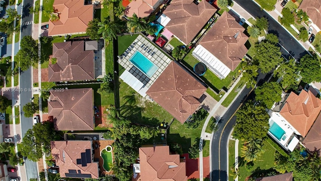 birds eye view of property with a residential view