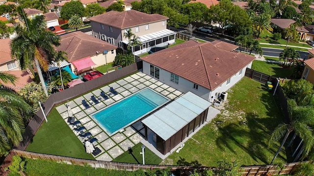 birds eye view of property with a residential view