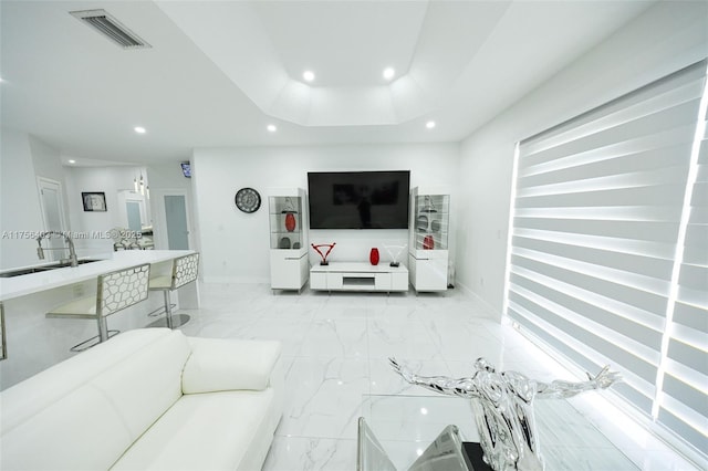 living room featuring marble finish floor, baseboards, visible vents, and recessed lighting