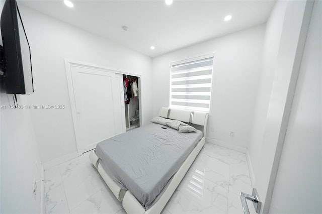 bedroom with marble finish floor, baseboards, a closet, and recessed lighting