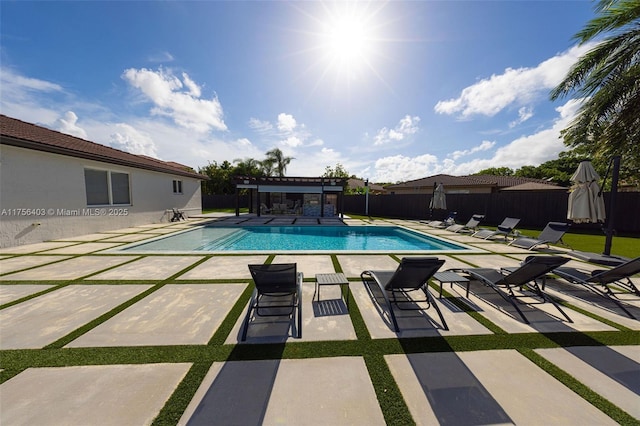 view of pool featuring a fenced in pool, fence, a patio, and a pergola