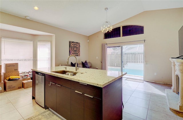 kitchen with dishwasher, vaulted ceiling, a sink, and light tile patterned flooring