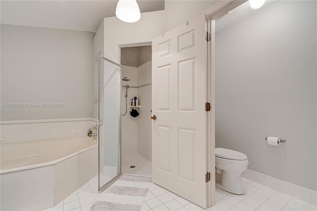 full bathroom featuring toilet, tile patterned flooring, a shower stall, and a bath