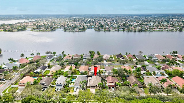 aerial view featuring a water view and a residential view