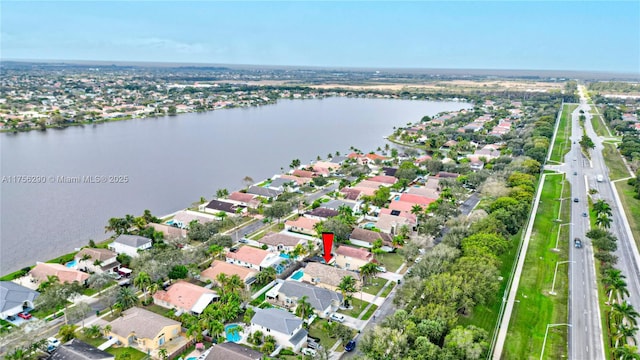 aerial view featuring a residential view and a water view