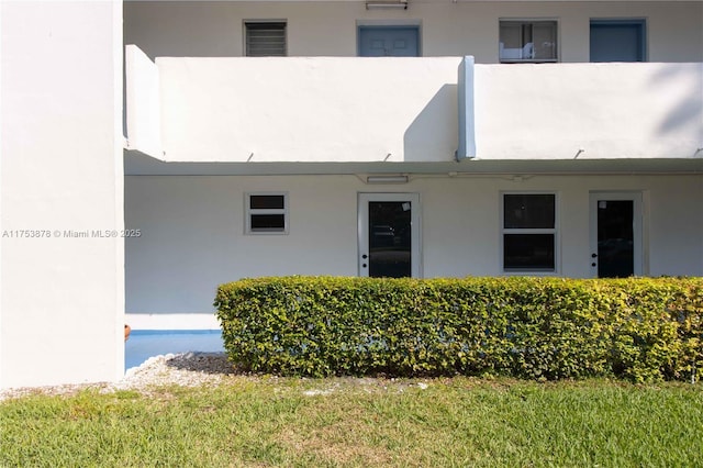 exterior space featuring stucco siding