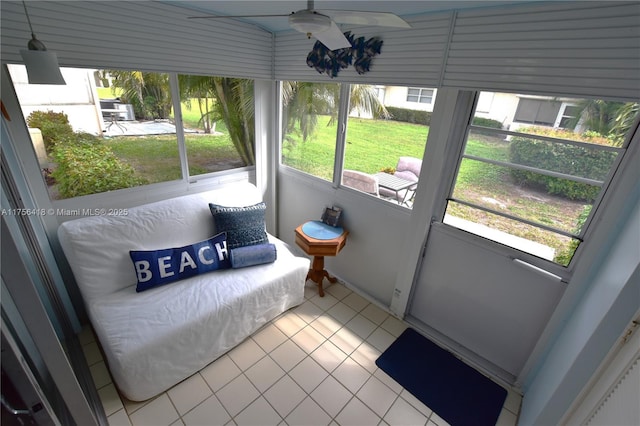 sunroom with a ceiling fan