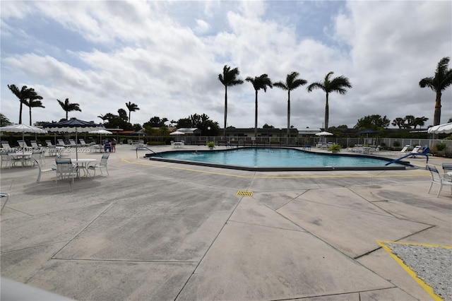 pool featuring a patio area and fence