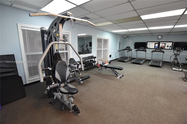 workout area featuring a paneled ceiling and visible vents