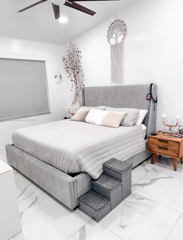 bedroom featuring marble finish floor and a ceiling fan