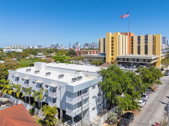 birds eye view of property with a city view