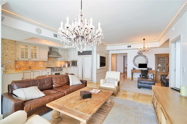 living room with ornamental molding, a raised ceiling, visible vents, and an inviting chandelier