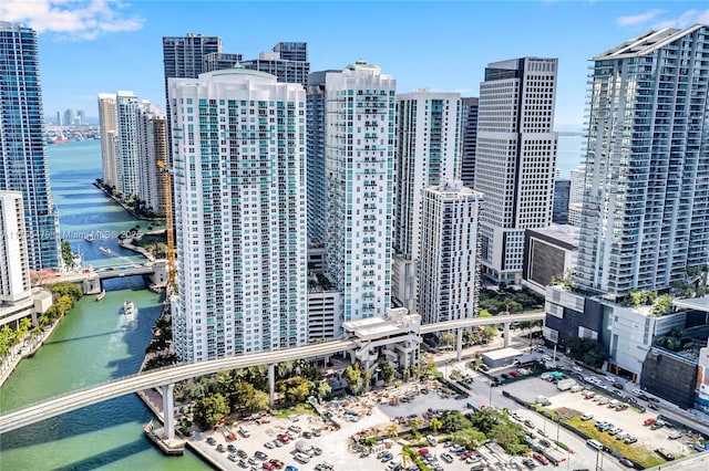 bird's eye view featuring a view of city and a water view