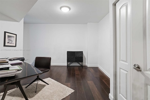 office space featuring dark wood-style floors and baseboards