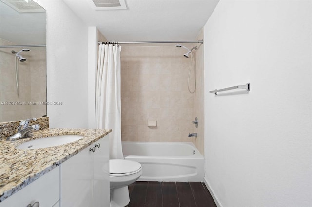 bathroom featuring shower / bath combination with curtain, visible vents, toilet, vanity, and wood finished floors