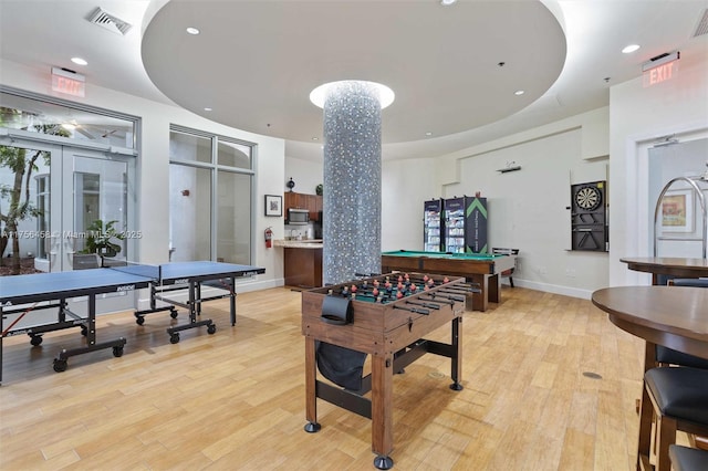 game room with recessed lighting, visible vents, baseboards, french doors, and light wood-type flooring