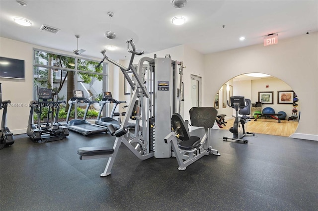 exercise room featuring baseboards and visible vents