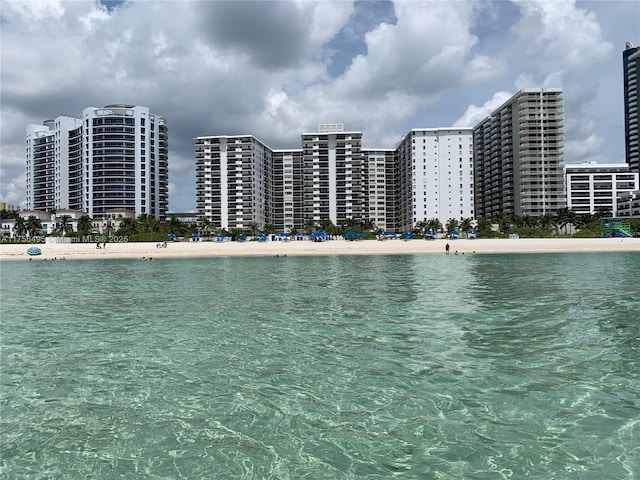 water view featuring a view of city and a beach view