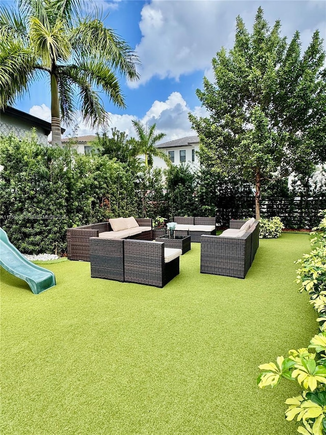 view of yard featuring an outdoor hangout area and a playground