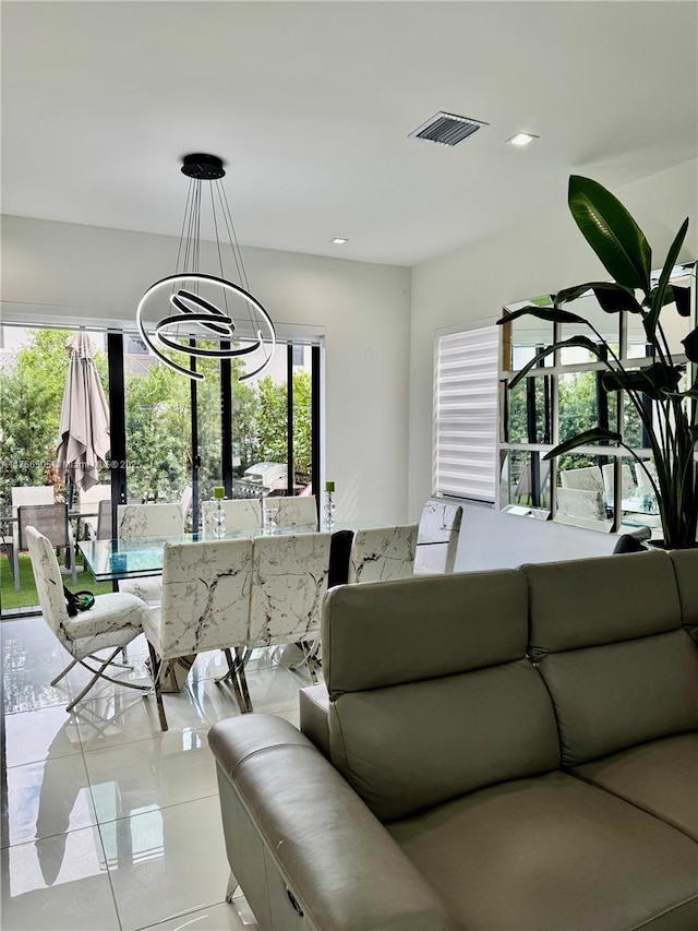 living room featuring recessed lighting, visible vents, light tile patterned flooring, and an inviting chandelier