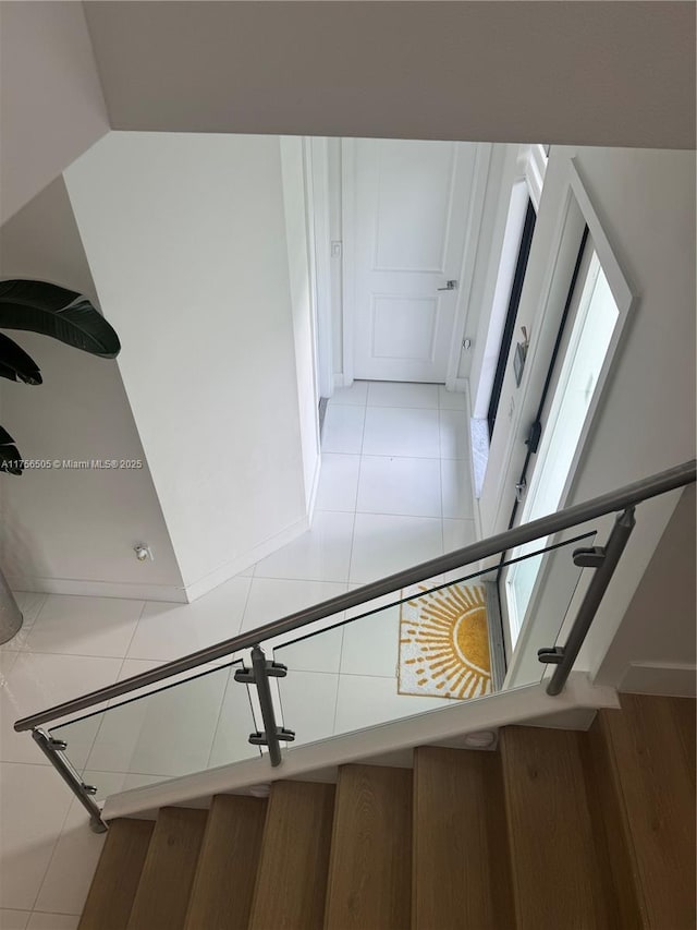 stairs with tile patterned floors