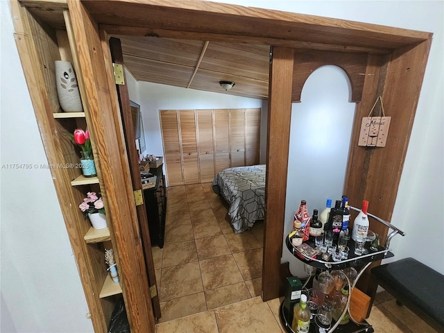 hallway featuring vaulted ceiling