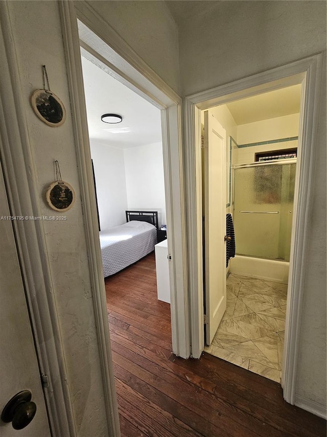 hallway featuring hardwood / wood-style floors