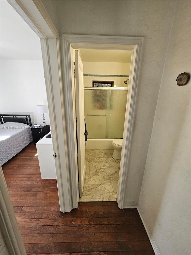 hallway with wood finished floors