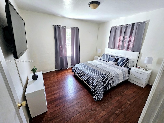 bedroom with hardwood / wood-style flooring