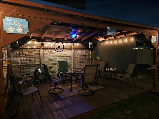 wooden terrace featuring outdoor dining area