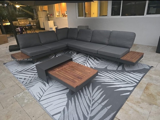 living room featuring stone tile flooring