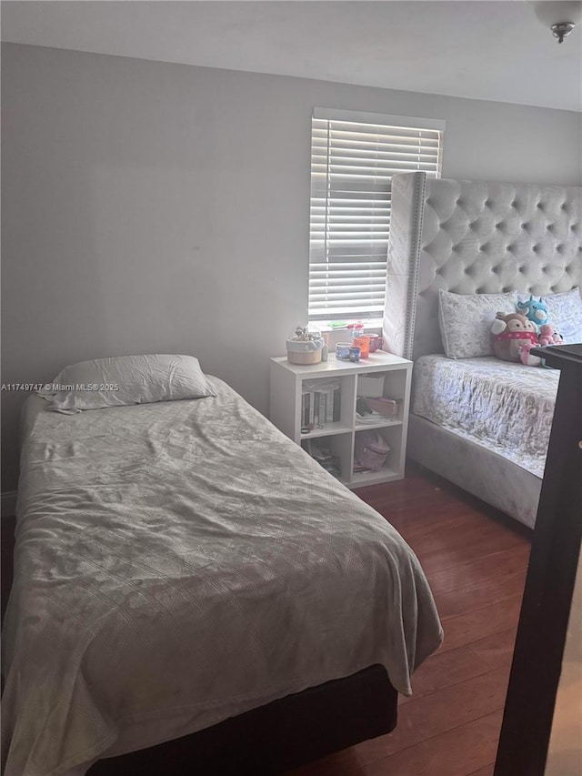 bedroom with wood finished floors