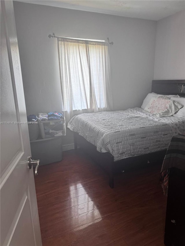 bedroom featuring hardwood / wood-style floors