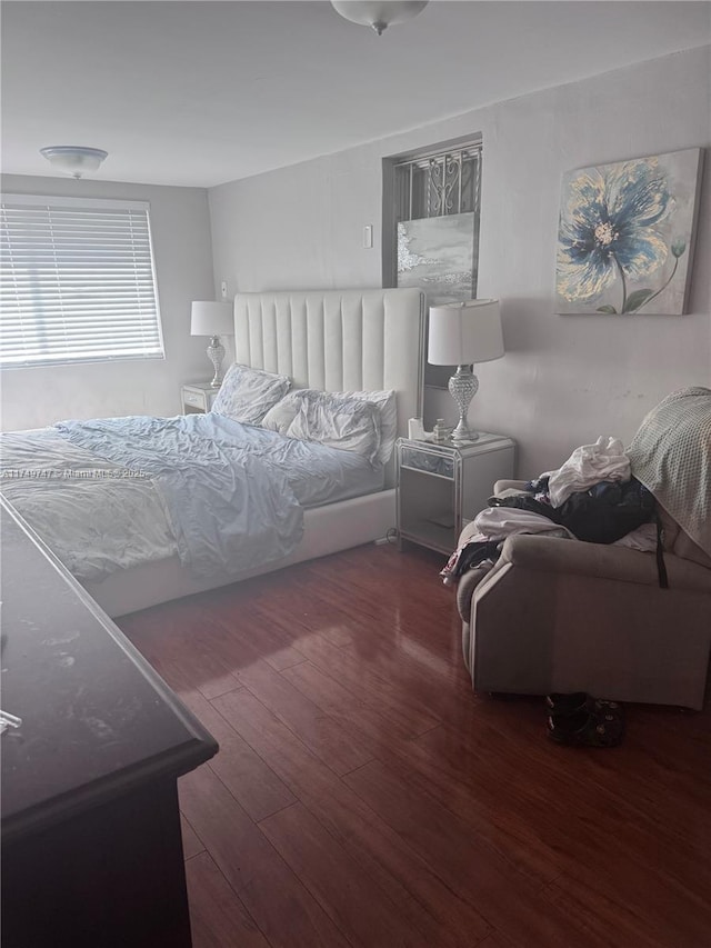 bedroom featuring wood finished floors