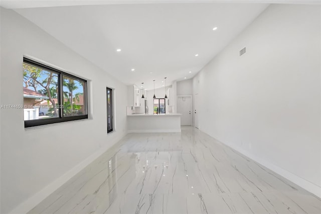 spare room featuring marble finish floor, baseboards, visible vents, and recessed lighting